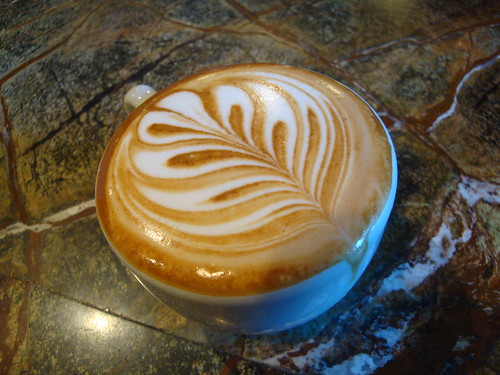 Another amazing latte art that defies gravity (and spillage) on Nicelys flickr page. Poured by Teal Allan.