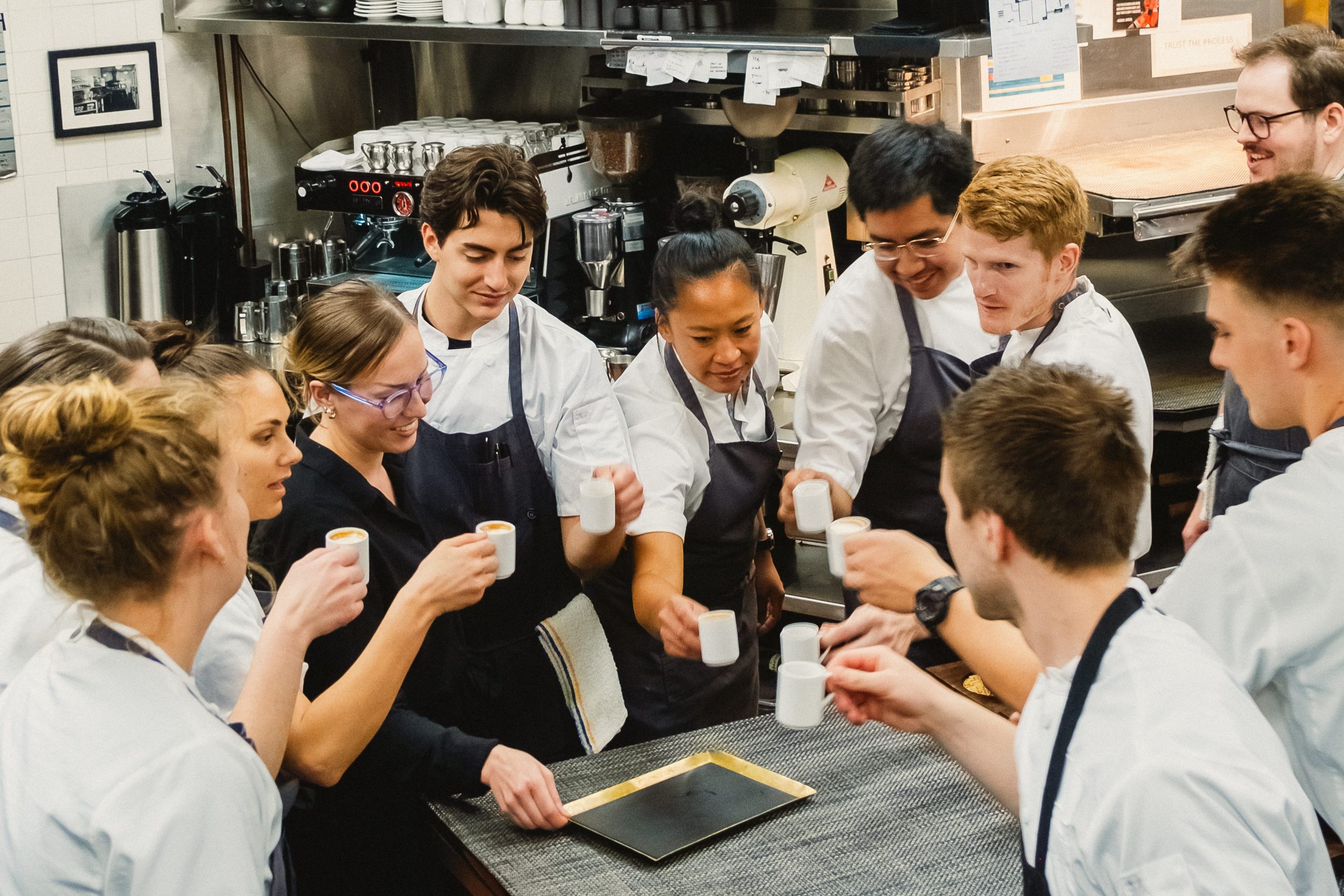 the kitchen staff enjoying espresso together