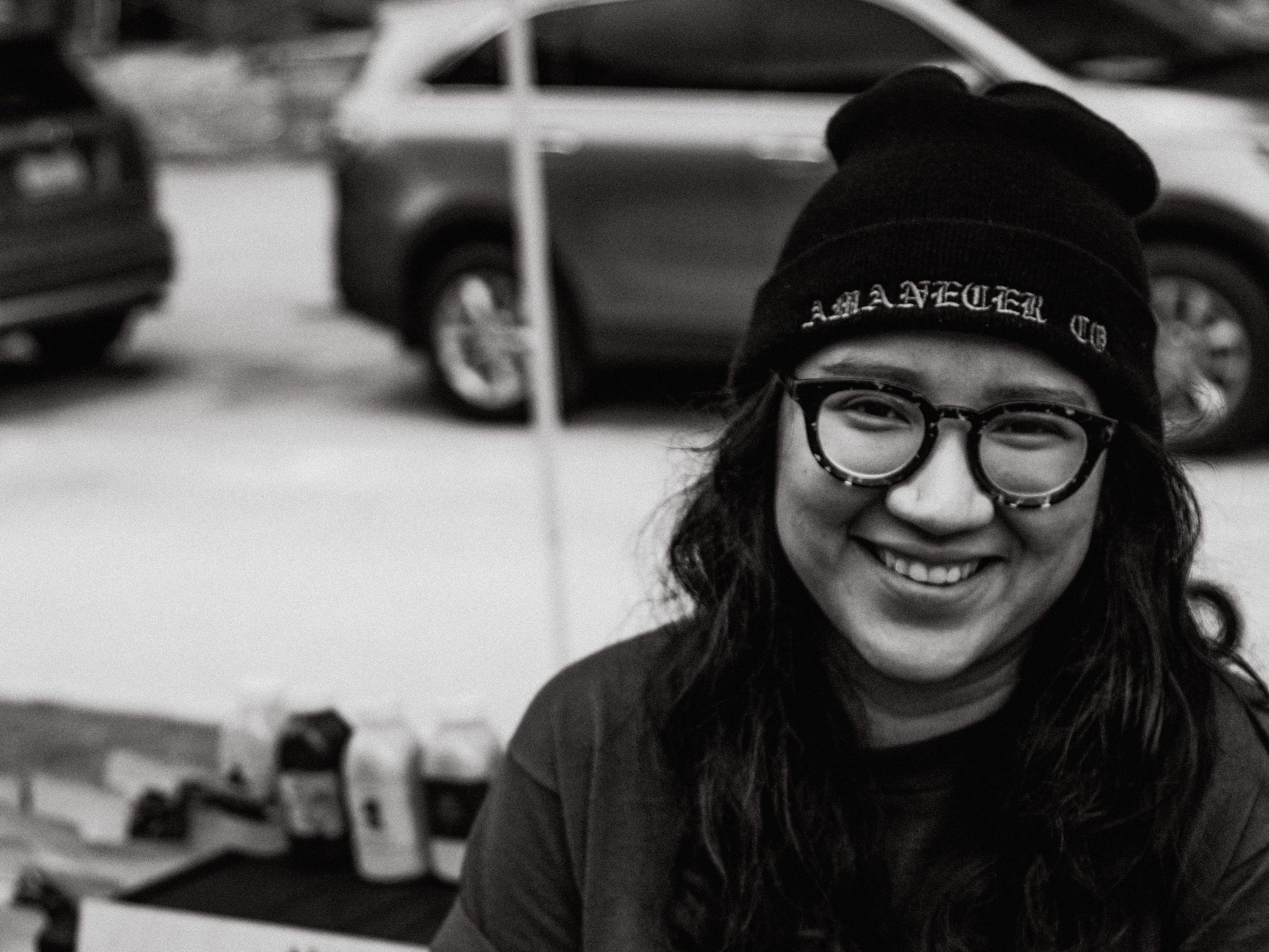 a photo of marlen mendoza in front of a coffee cart