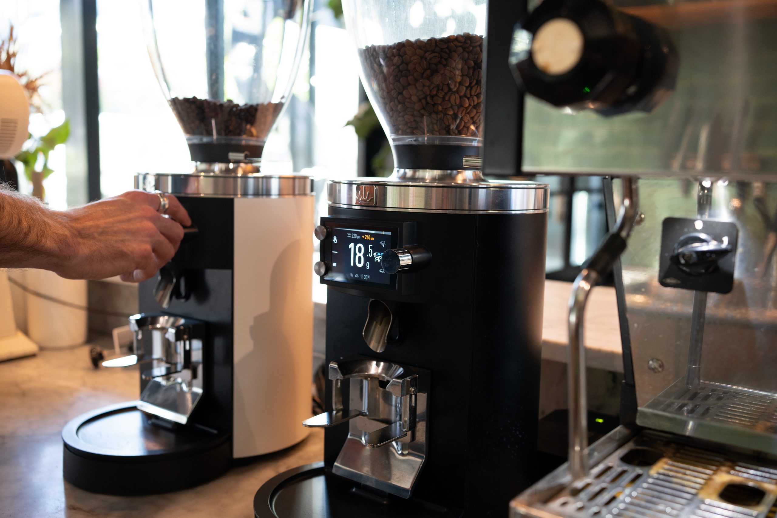 two sync grinders showing their displays