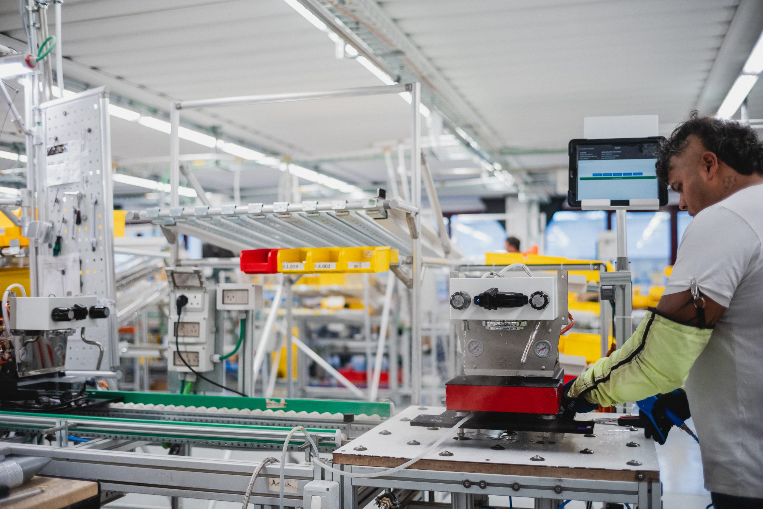 a linea micra having its hot water tap tested by a factory artisan