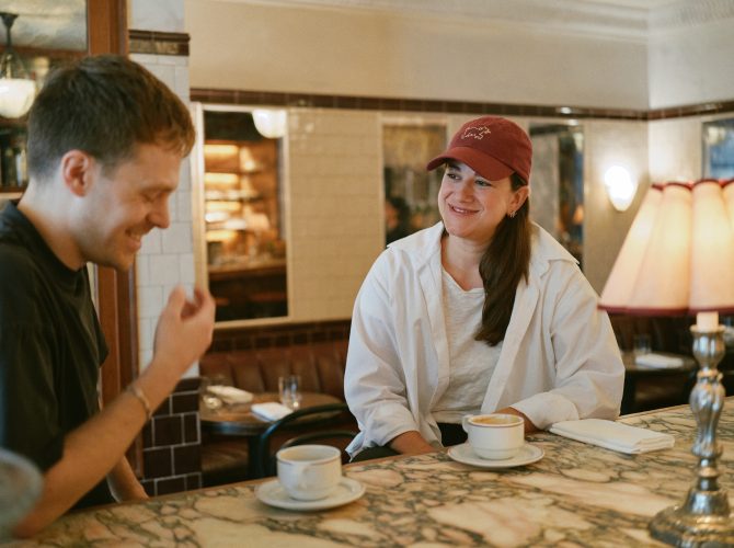 Two people chatting over coffee