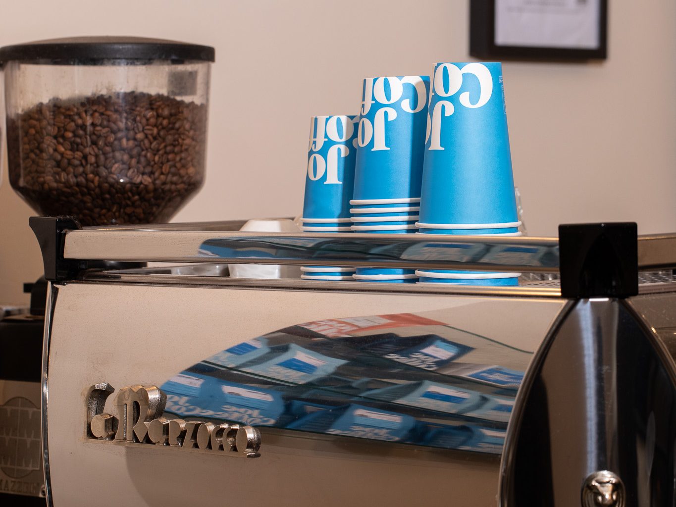 the front of a GB5 with Joe Coffee cups on top of it