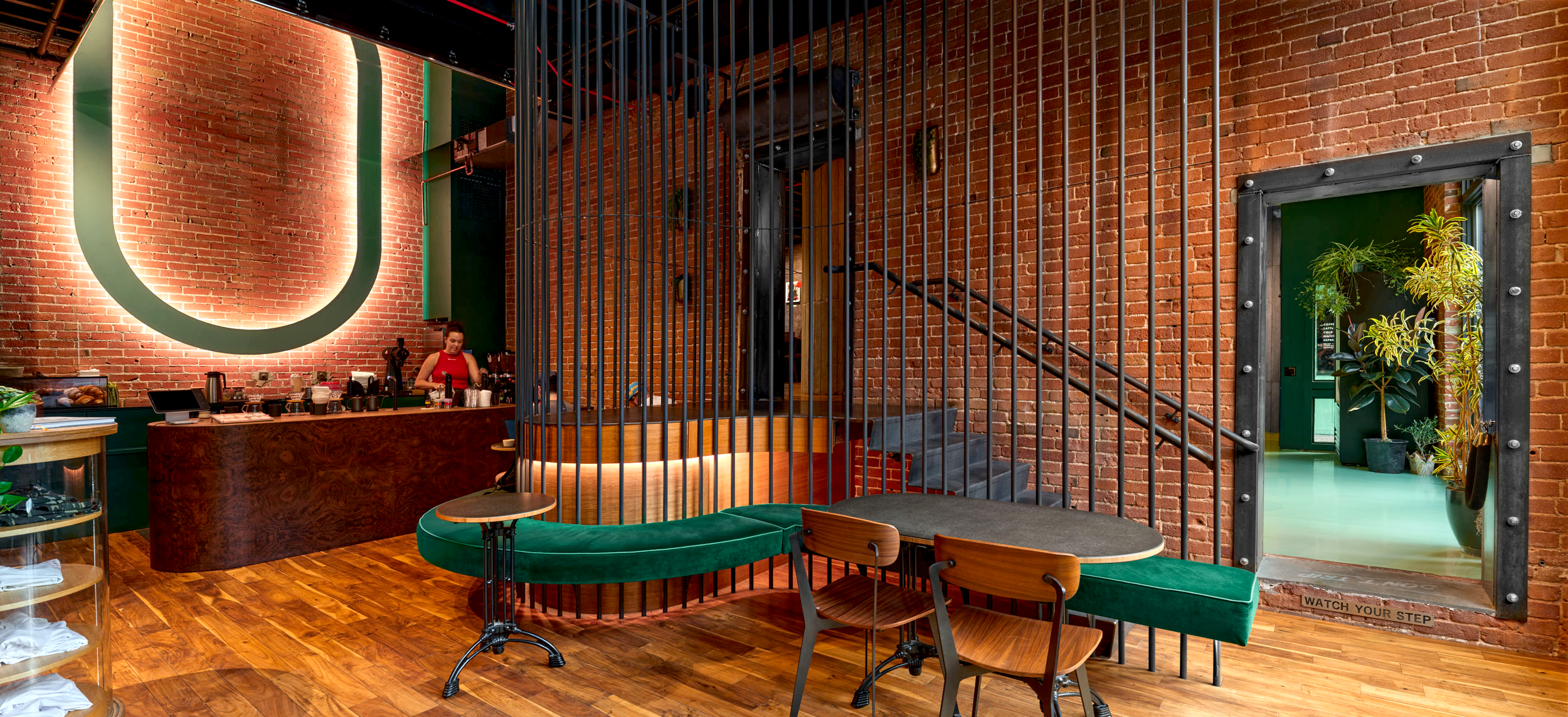 the interior of slow by slow coffee bar in boise, with wood panelling and a distinct walnut bar